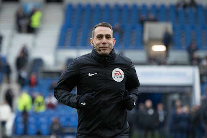 Coote warming up for an FA Cup clash between Brighton and Liverpool.